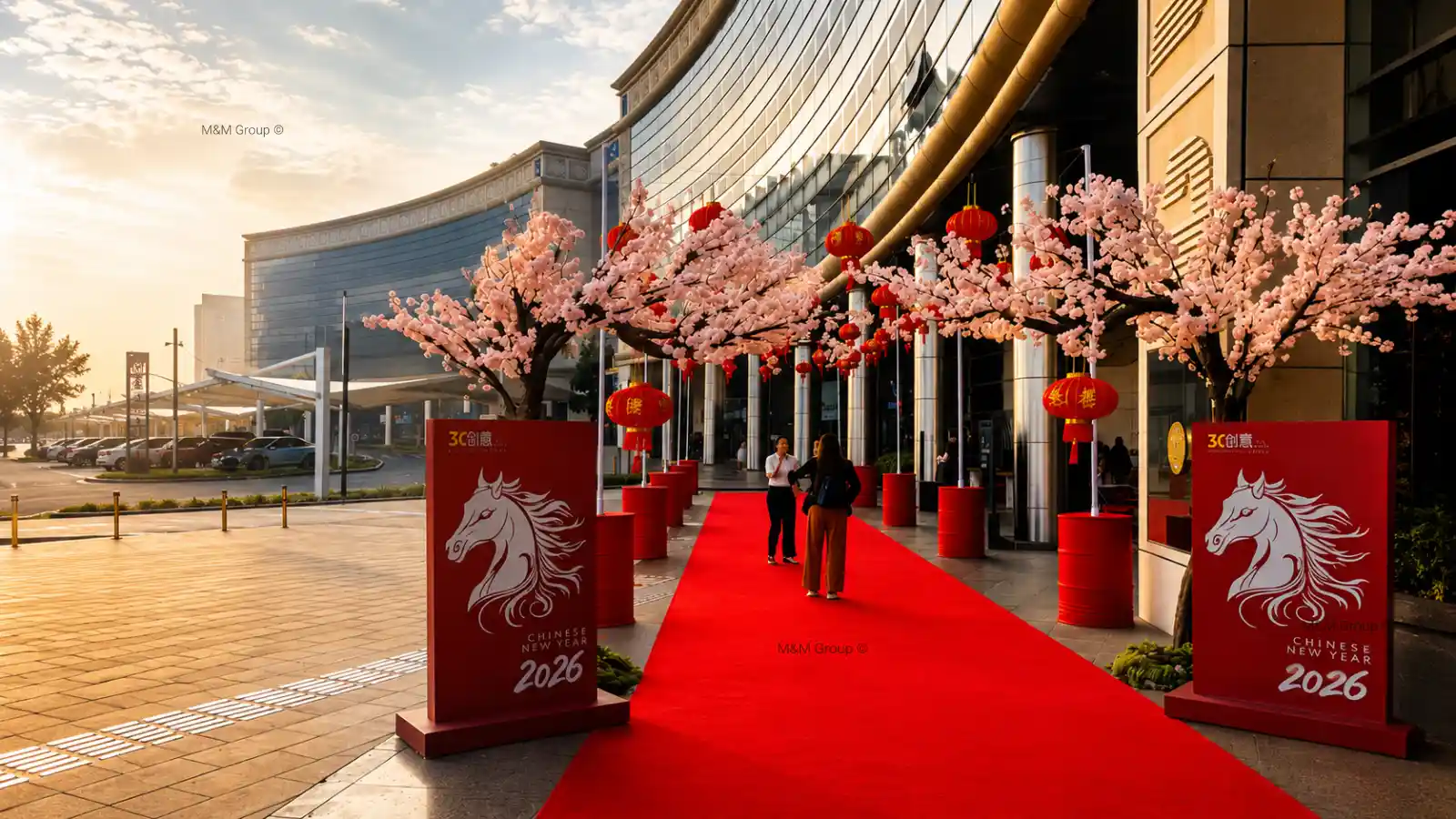 DAFZ Chinese New Year 2026 red carpet entrance activation with cherry blossom décor and hanging lantern installations at Dubai Airport Freezone