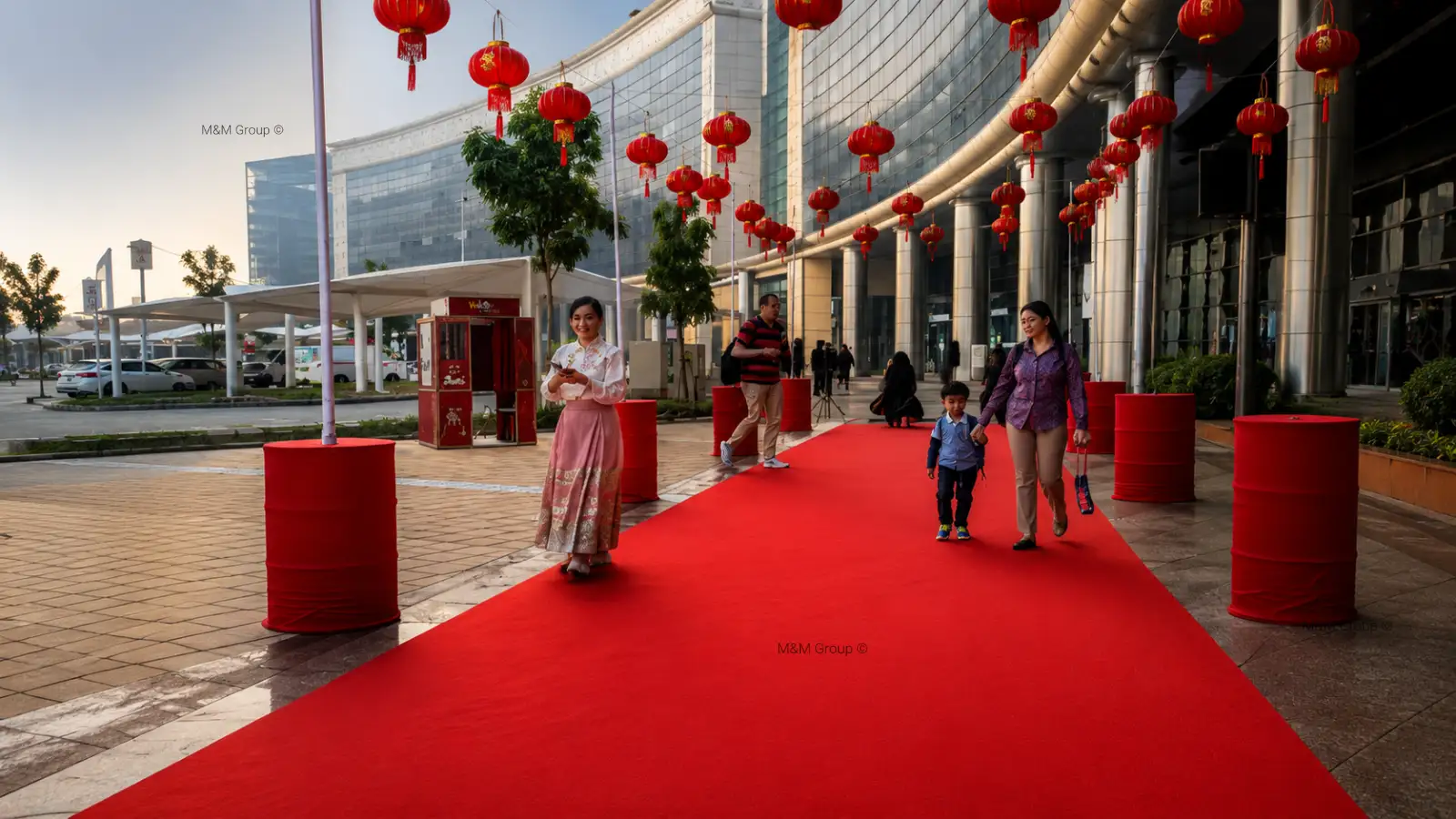 Guests arriving through the DAFZ Chinese New Year 2026 red carpet entrance with hanging lantern decorations at Dubai Airport Freezone