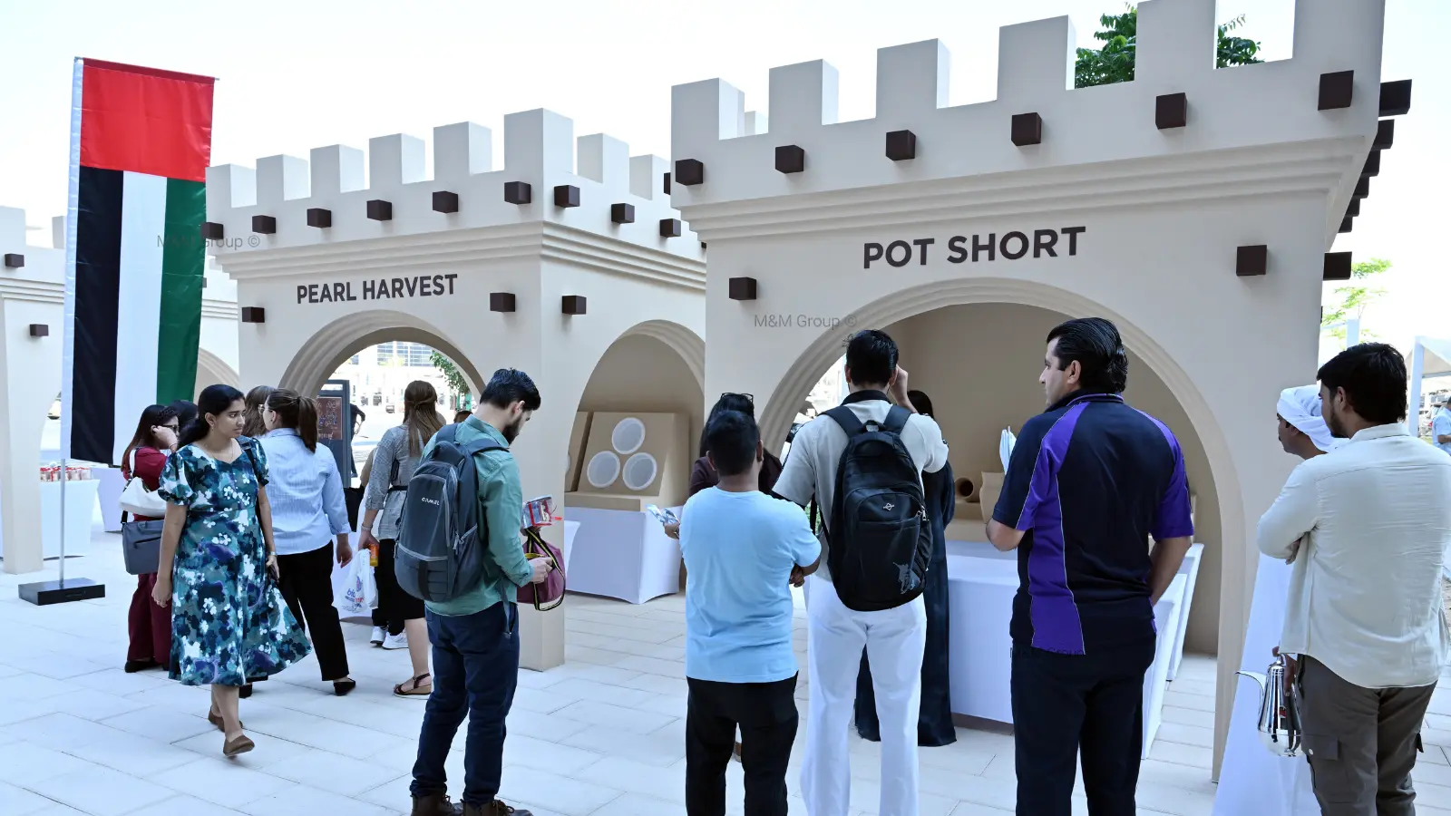 Guests exploring traditional cultural market activations during the Dubai Airport Freezone UAE National Day celebration in Dubai