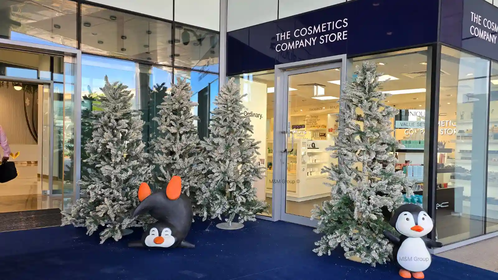 DAFZ Winter Festival décor with penguin displays and snow-covered trees in Dubai