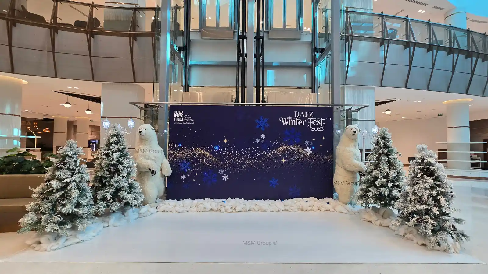 DAFZ Winter Festival photo backdrop with polar bear displays and snow-covered trees in Dubai